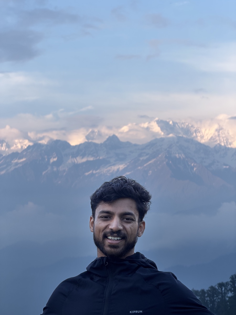Portrait of Srijan smiling on the Dayara Bugyal trek