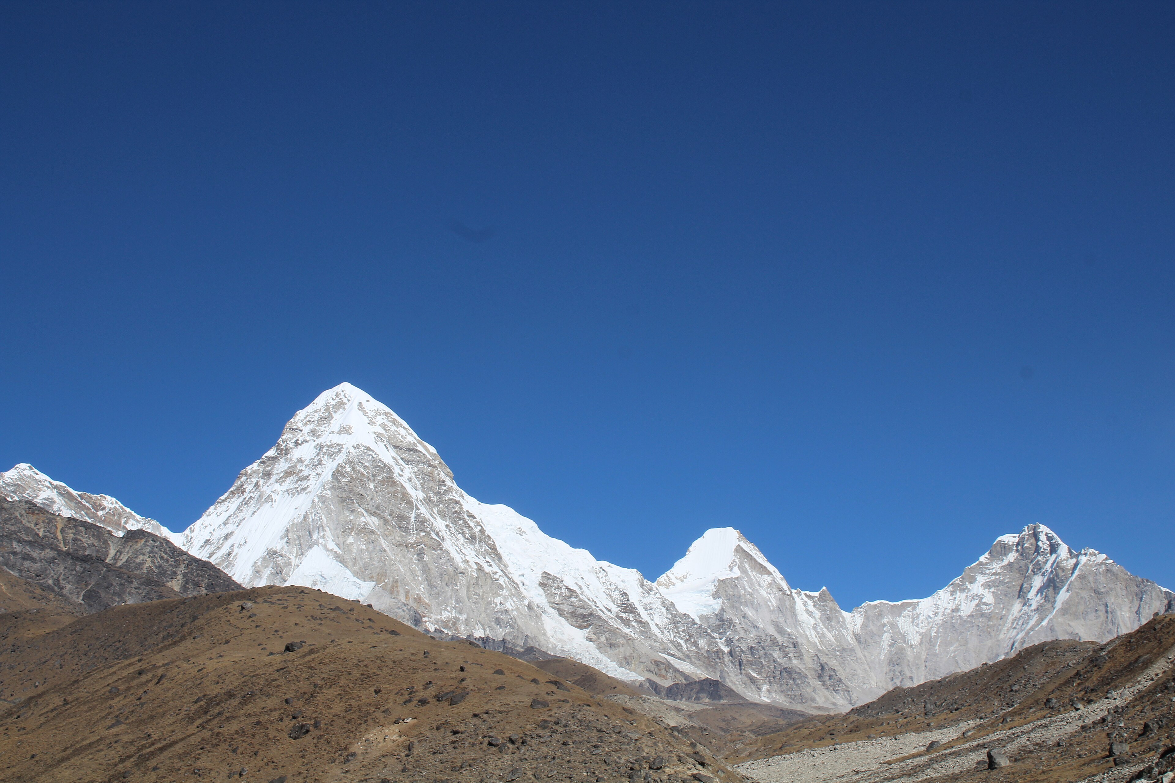 Rocky glacial terrain and snow-covered peaks near Everest Base Camp in Nepal