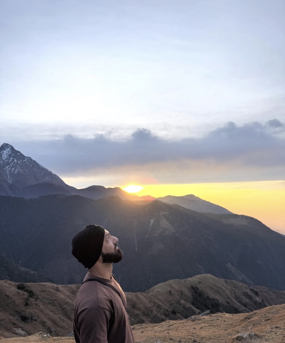 Portrait of Dilip looking toward the sky during sunset on the Laka Glacier trek