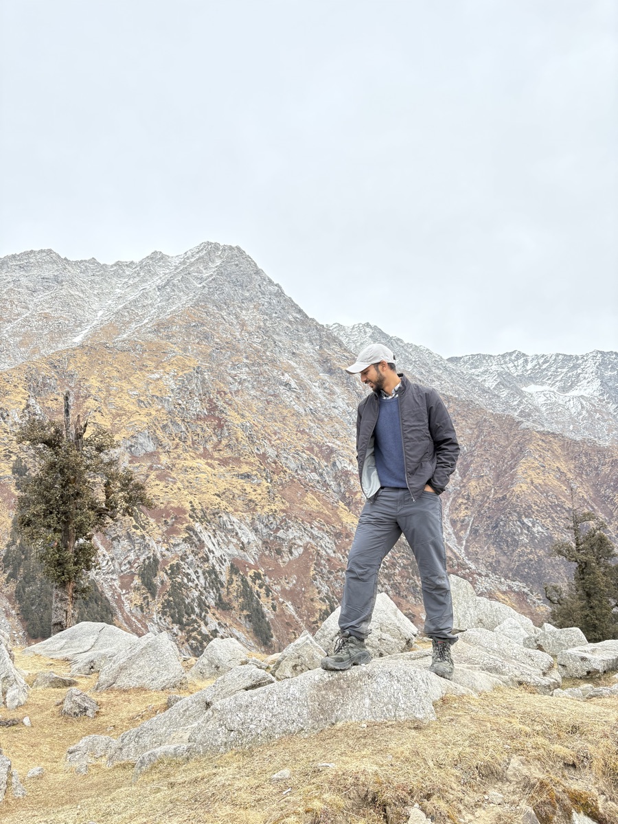 Portrait of Srijan standing among rocks on the Laka Glacier trail