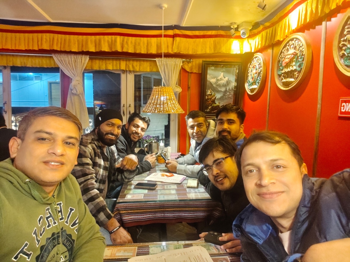 The seven Laka Glacier trekkers gathered around a table at Kalimpong Restaurant