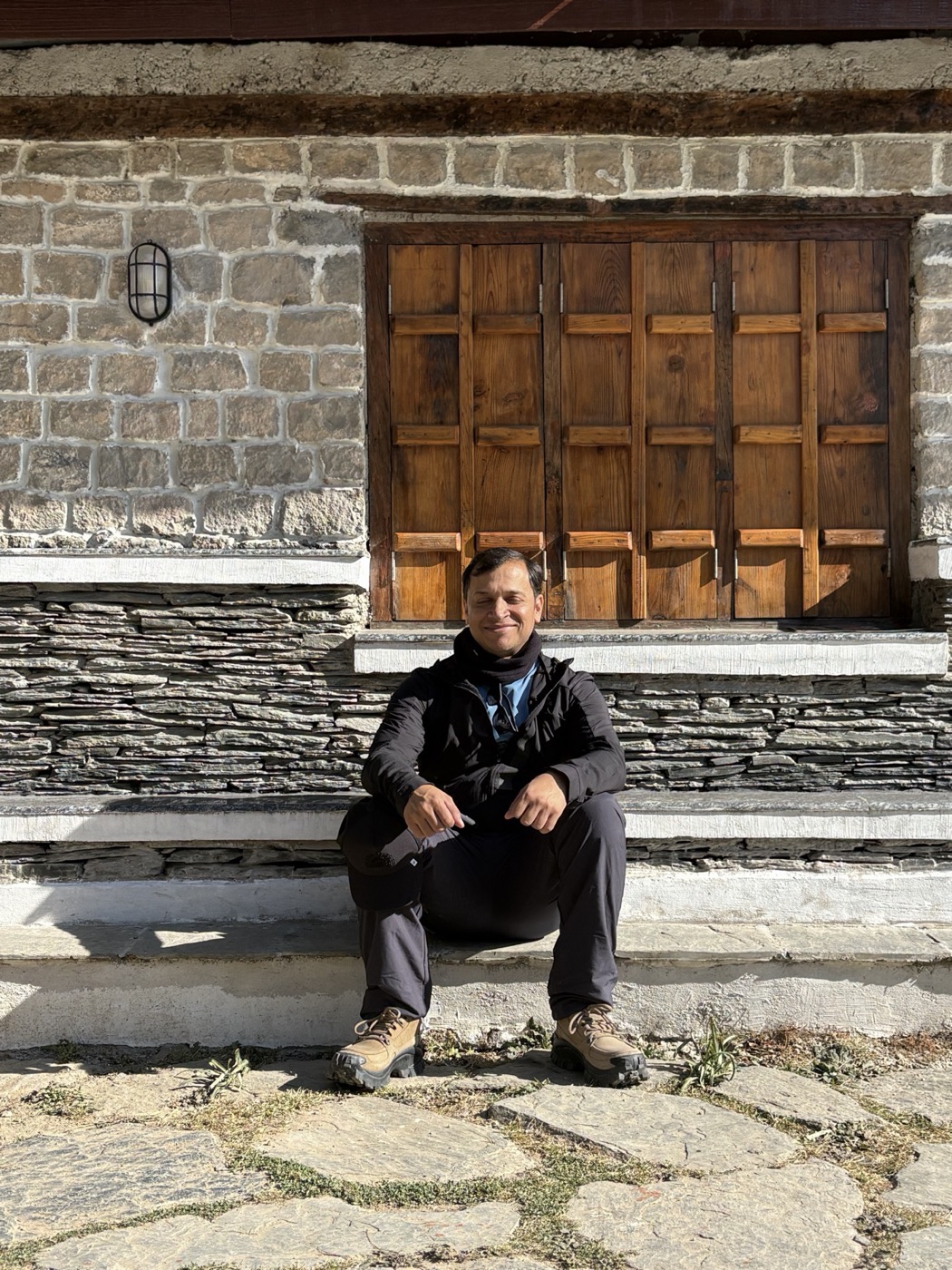 Amit sitting in the morning sun before the trek to Triund