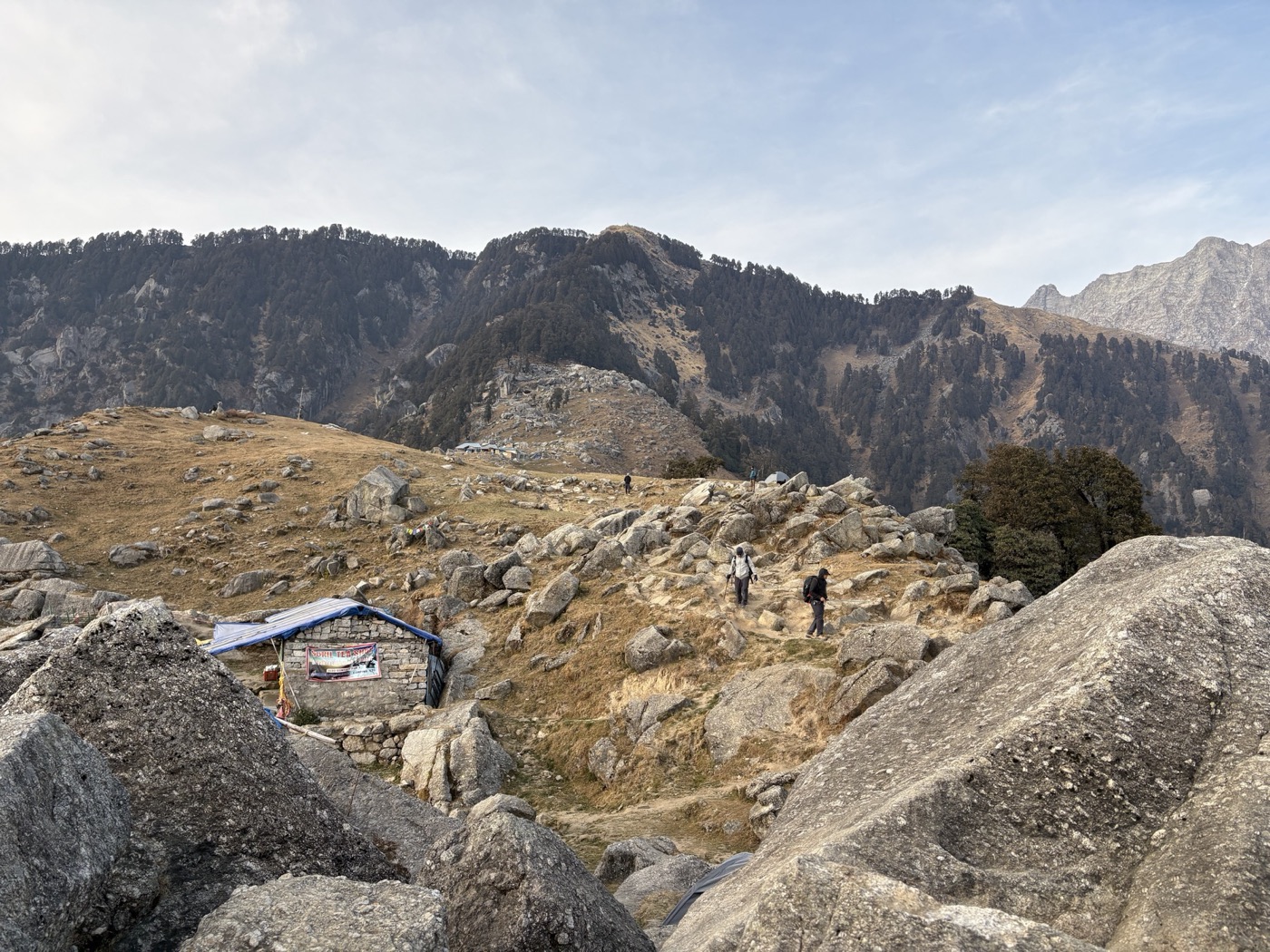 The rocky Triund trail with the campsite still visible on the next hill